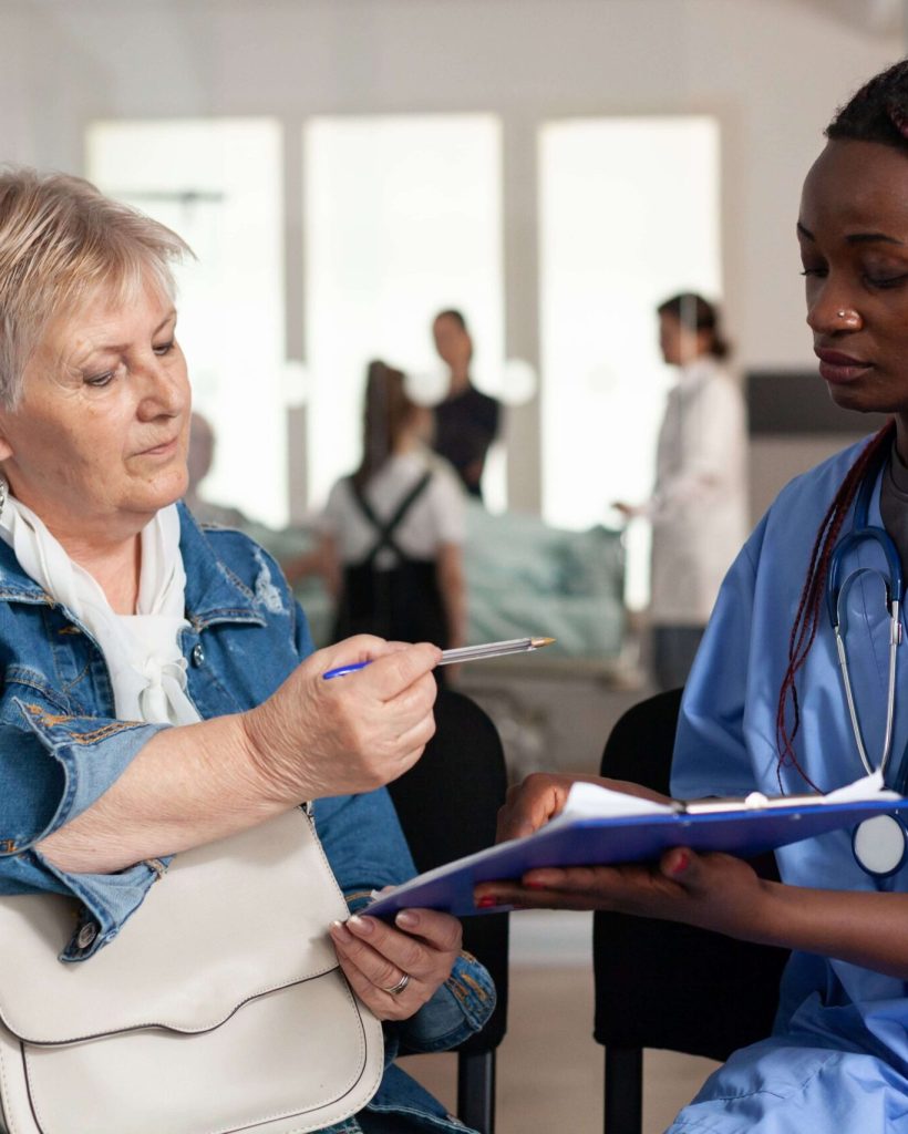 african-american-nurse-explaining-sickness-treatme-2022-01-19-00-06-12-utc-min (1)